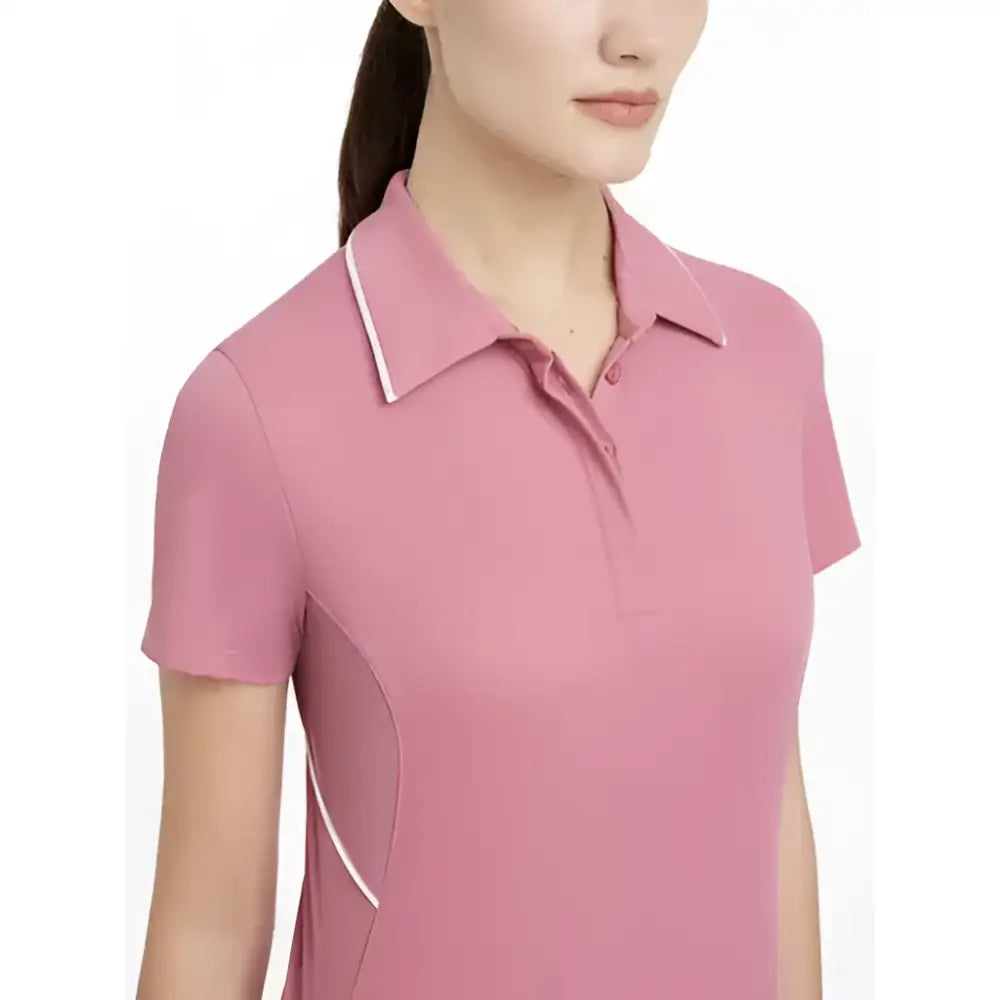 A soft pink lemieux venus performance polo with white trim on collar and side seams in performance polo peony style