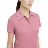 A soft pink lemieux venus performance polo with white trim on collar and side seams in performance polo peony style
