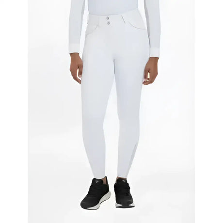 White riding pants with sleek fit and subtle stitching featuring silicone seat white in lemieux victoria breech design
