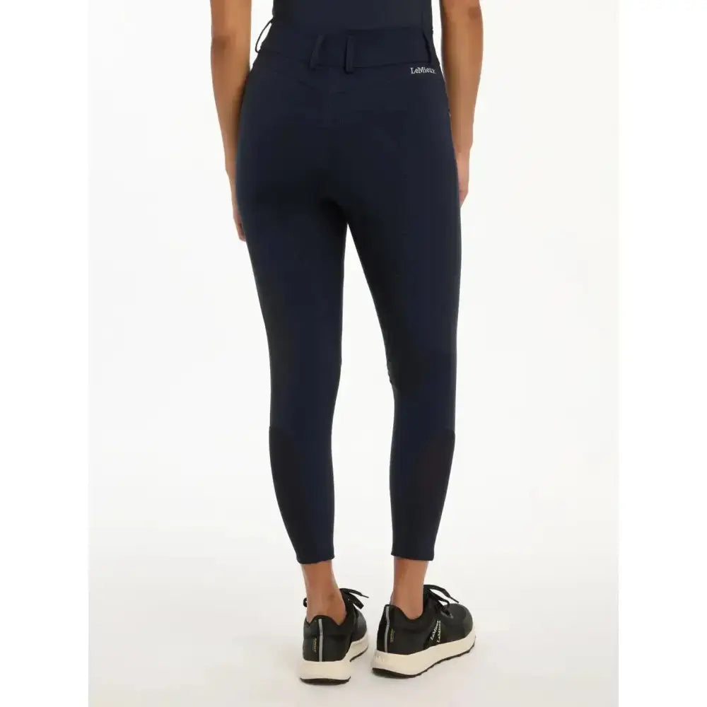 Navy blue lemieux victoria breech stretch leggings with subtle brand logo on back waistband and suede seat navy panel
