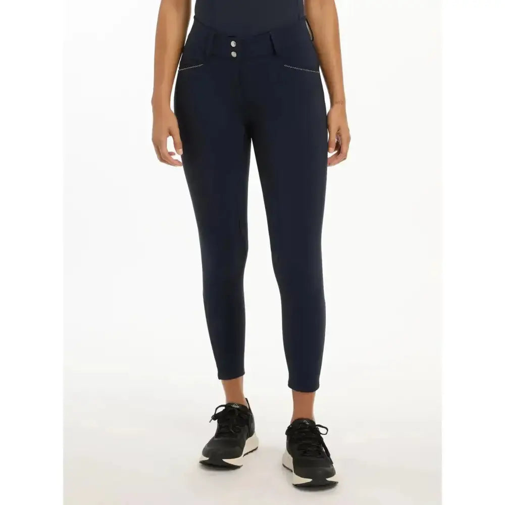 Navy blue high waisted lemieux victoria breech leggings with two front pockets and victoria breech suede seat navy details