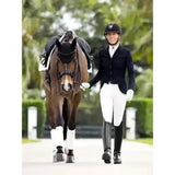 A sleek black riding helmet with a subtle logo paired with lemieux victoria breech suede seat white breeches