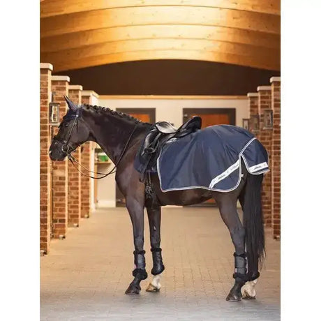 Navy blue lemieux waterproof exercise quarter sheet with white trim and cosy fleece lining for riding use
