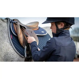 Navy blue quilted lemieux wither relief jump pad with gray trim and red brand tag for wither relief