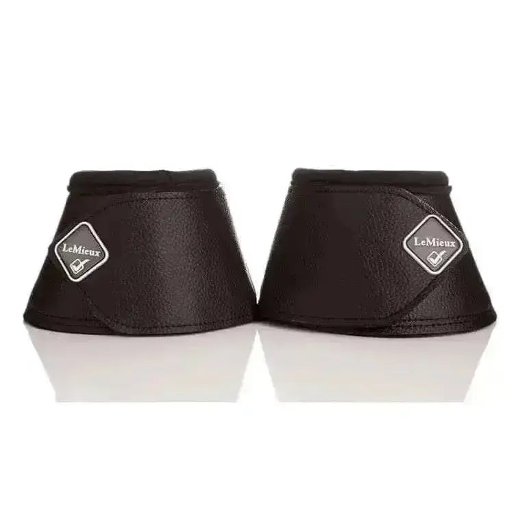 Black lemieux wrap round leather over reach boots with textured finish and diamond-shaped brand logo reach boots black