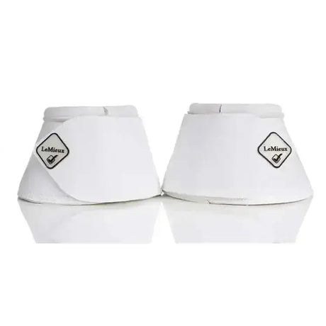 White leather lemieux wrapround leather overreach boots with diamond shaped logo patch on each reach boots white
