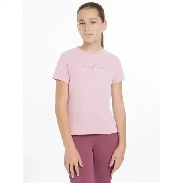 A soft pink lemieux young rider arianna t-shirt with short sleeves and a subtle signature lemieux autograph embroidered logo