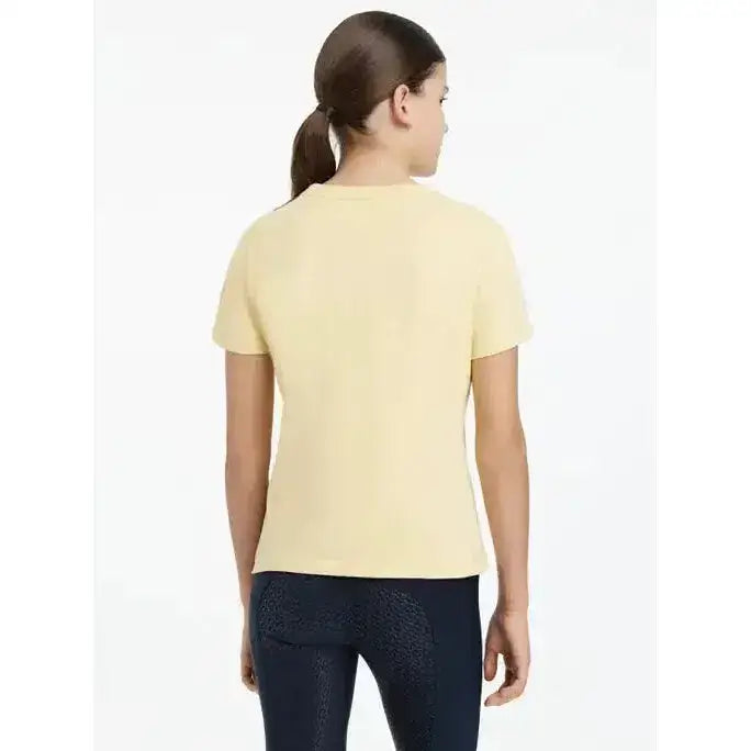 A pale yellow lemieux young rider arianna t-shirt with hot fix silver details and a simple round neckline