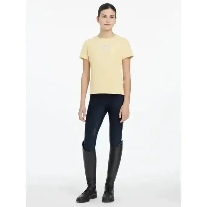 Pale yellow lemieux young rider arianna t-shirt with subtle hot fix silver signature lemieux autograph logo on chest