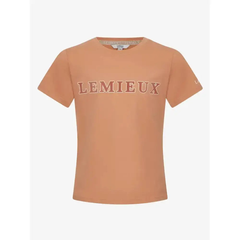 A soft peach cotton young rider arianna t-shirt sherbet with matching lemieux logo across the chest
