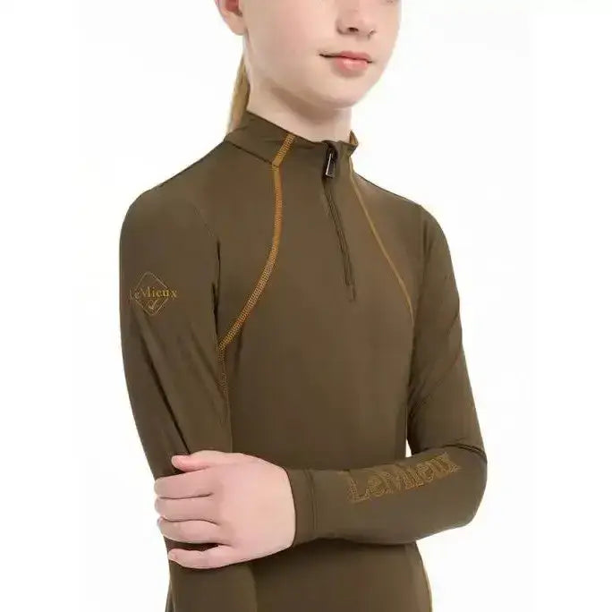Olive green long-sleeved lemieux young rider base layer alpine top with gold stitching and logo detailing