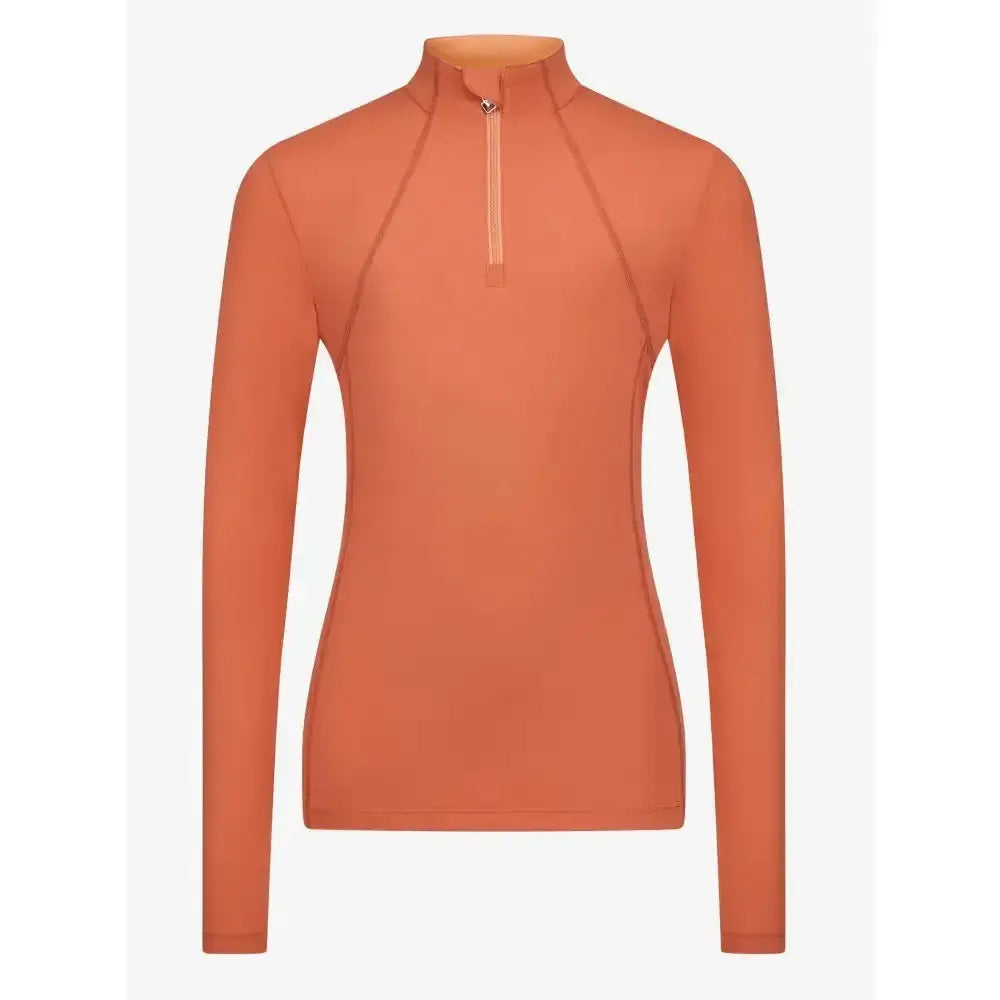 A sleek long-sleeved orange lemieux young rider base layer apricot with high collar and half-zip closure