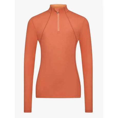 A sleek long-sleeved orange lemieux young rider base layer apricot with high collar and half-zip closure