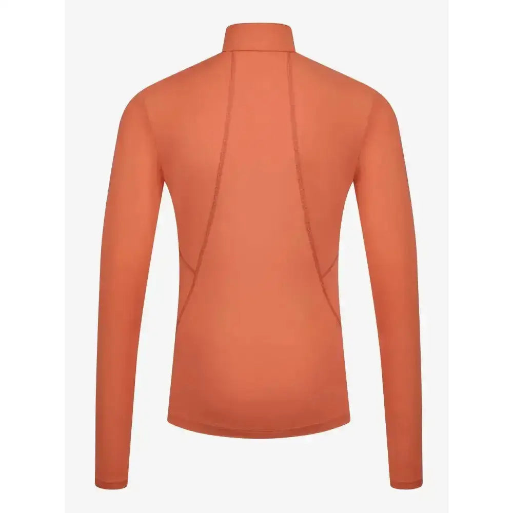 A sleek lemieux young rider base layer apricot long-sleeve high-neck top with subtle seam details