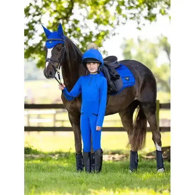 Blue lemieux young rider base layer with flat-lock stitching paired with matching helmet and hoof guards