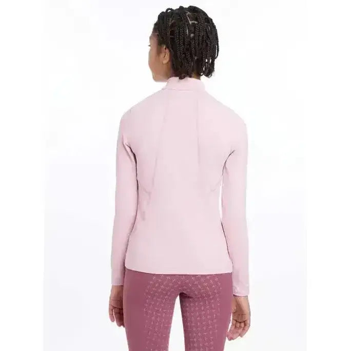 A soft pink lemieux young rider base layer blossom jacket with long sleeves high collar and subtle seam details