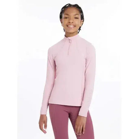 A soft pink lemieux young rider base layer blossom with long sleeves high collar and quarter zip closure