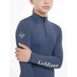 Navy blue long-sleeved lemieux young rider base layer dusk blue with white embroidered logo on sleeve