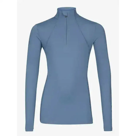 A sleek lemieux young rider base layer ice blue long-sleeved top with high collar and half-zip front