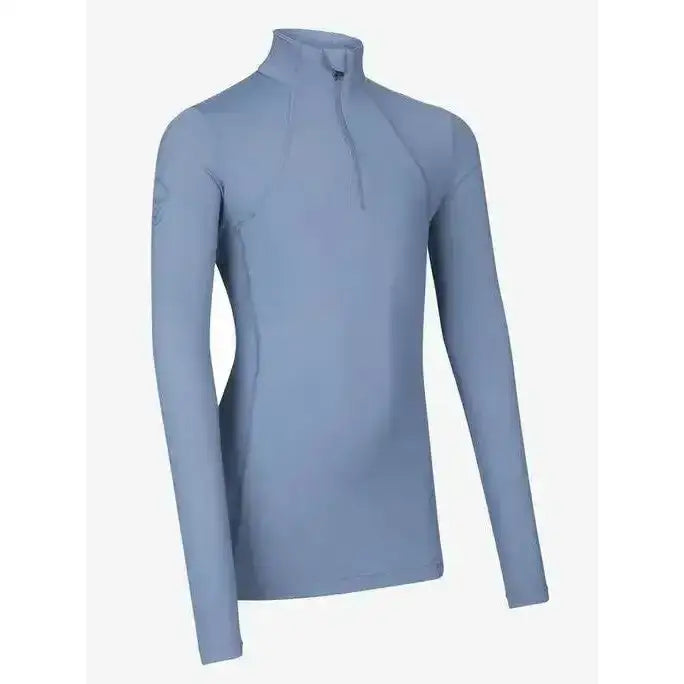 Light blue long sleeved rider base layer ice with half zip collar from lemieux young rider collection