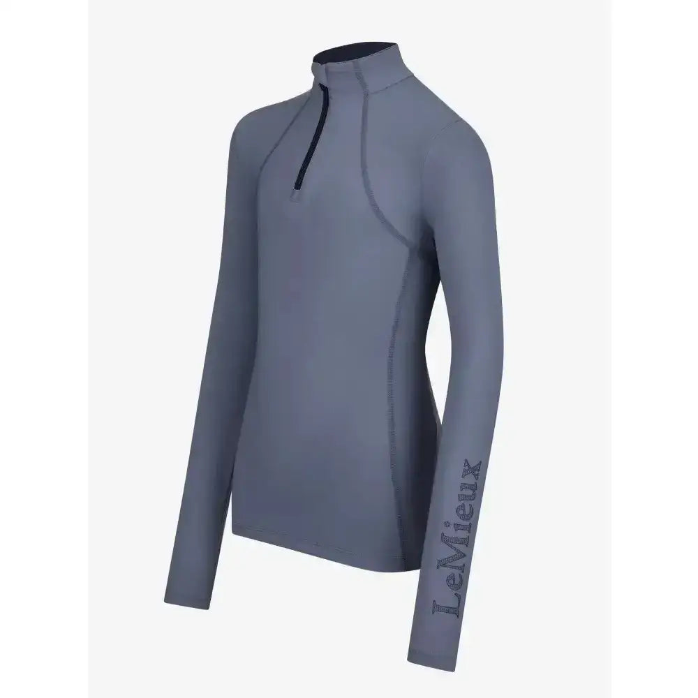 Gray long-sleeved lemieux young rider base layer jay with black zipper and branding on the sleeve