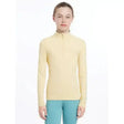 A pale yellow lemieux young rider base layer mimosa with long sleeves and a half-zip collar for performance wear