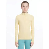 A pale yellow lemieux young rider base layer mimosa with long sleeves and a half-zip collar for performance wear