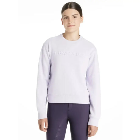 White long-sleeved lemieux young rider carmen crew sweat lilac with subtle embossed logo across the chest