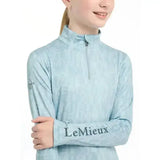 Light blue lemieux young rider casey base layer glacier long-sleeved performance top with subtle texture and sleeve branding