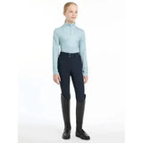 Light blue lemieux young rider casey base layer glacier with long sleeves subtle pattern and high collar for riding