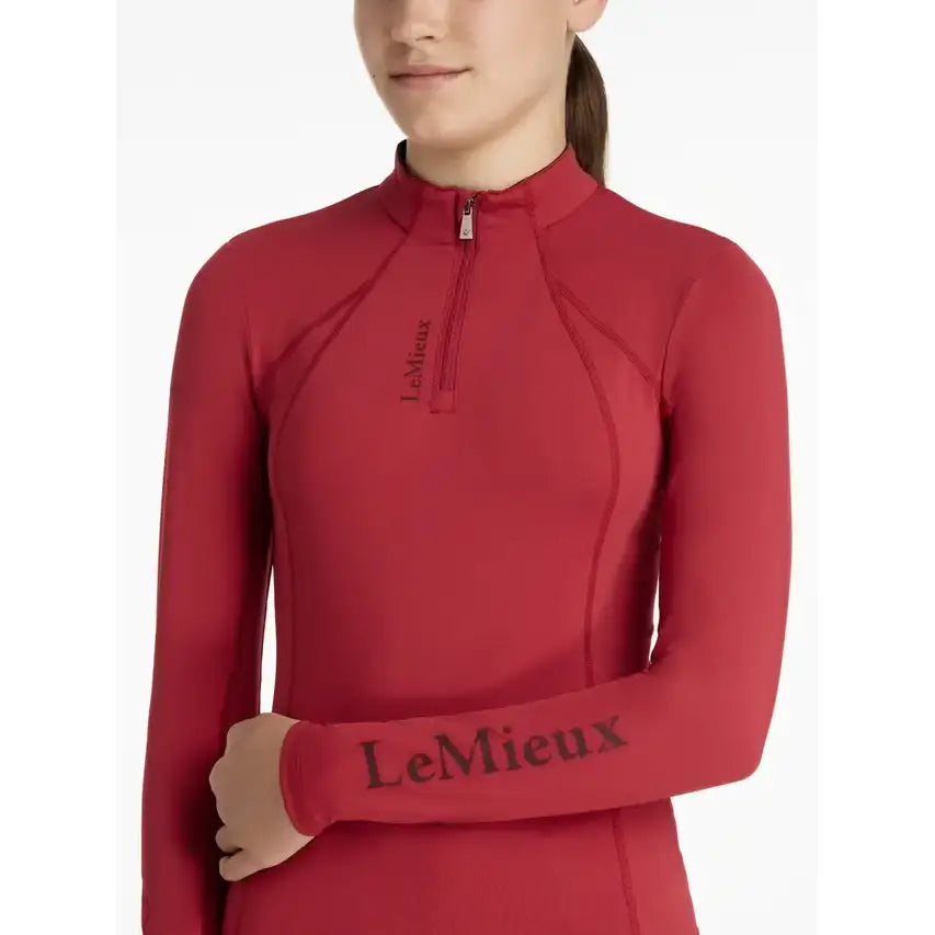 Red long-sleeved lemieux young rider classic rider chilli base layer top with half-zip and branded chest and sleeve