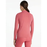 A sleek coral-pink seamless lemieux young rider classique base layer with high collar perfect for cranberry layer warmth
