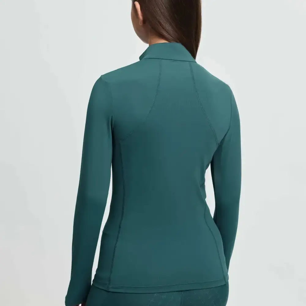 A sleek teal lemieux young rider classic rider jungle base layer jacket with long sleeves and a high collar