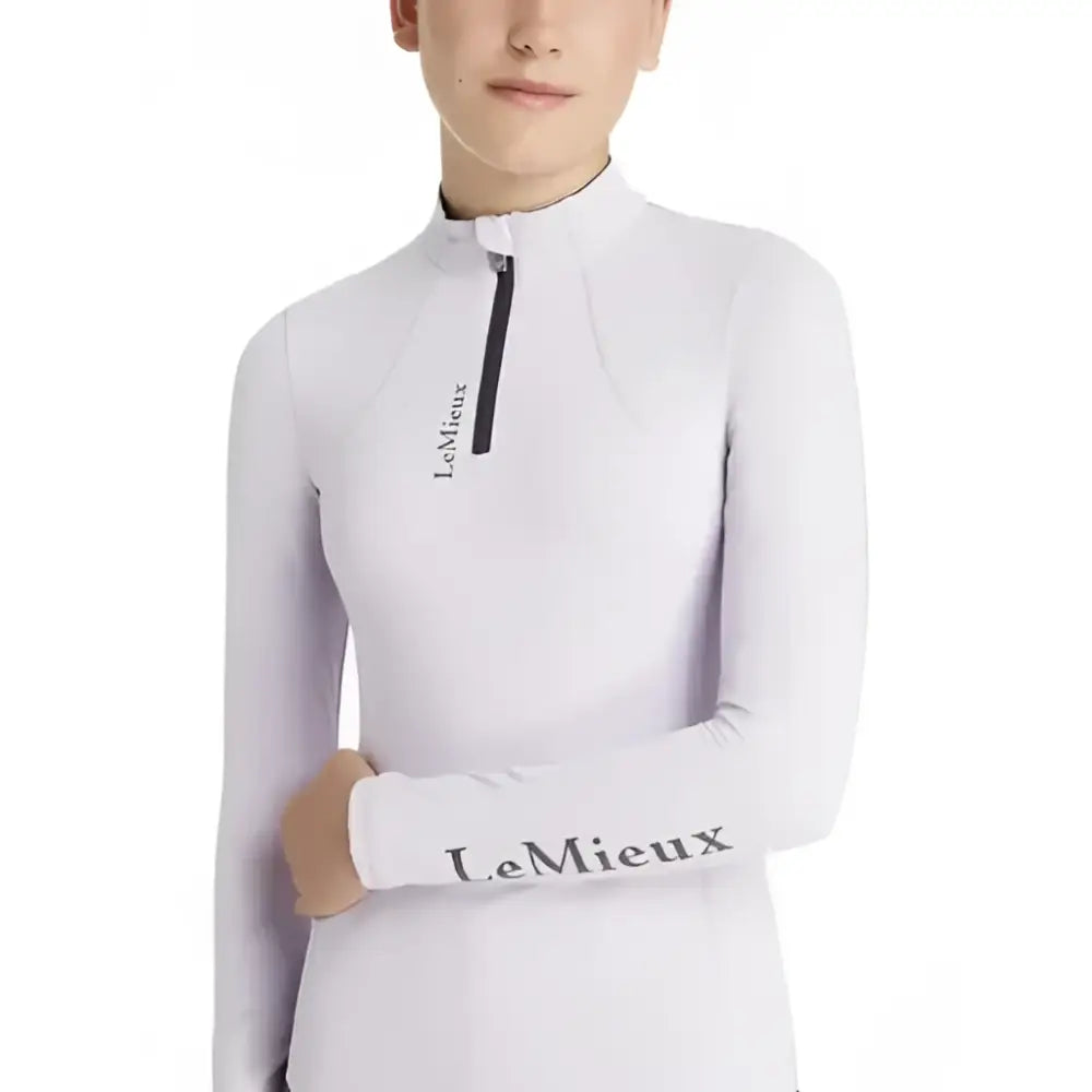 White long-sleeved lemieux young rider classique riding top with black zipper and layer lilac branding
