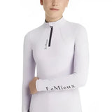 White long-sleeved lemieux young rider classique riding top with black zipper and layer lilac branding
