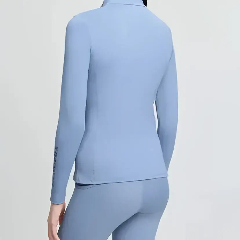 Light blue lemieux young rider classique base long sleeve athletic top with collar and subtle side seam detailing