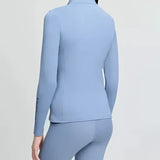 Light blue lemieux young rider classique base long sleeve athletic top with collar and subtle side seam detailing