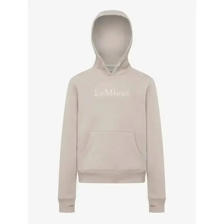 A soft beige lemieux young rider classique hoodie with a subtle embroidered logo across the chest