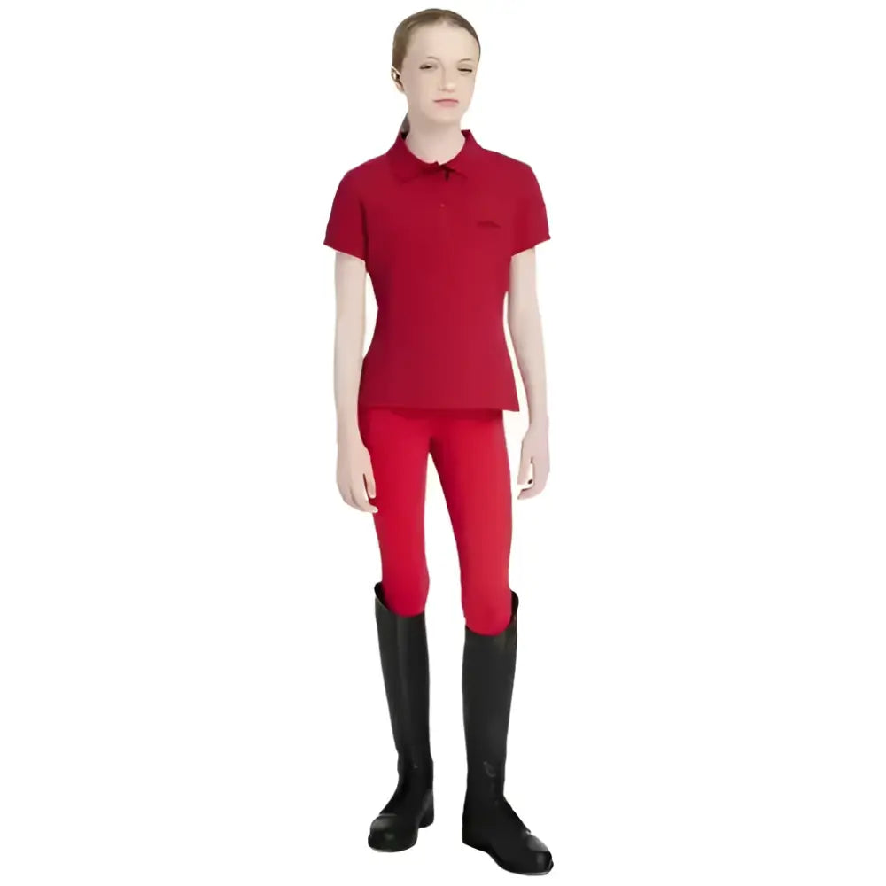 Red short-sleeved lemieux young rider classique polo shirt with collar and button placket in chilli color