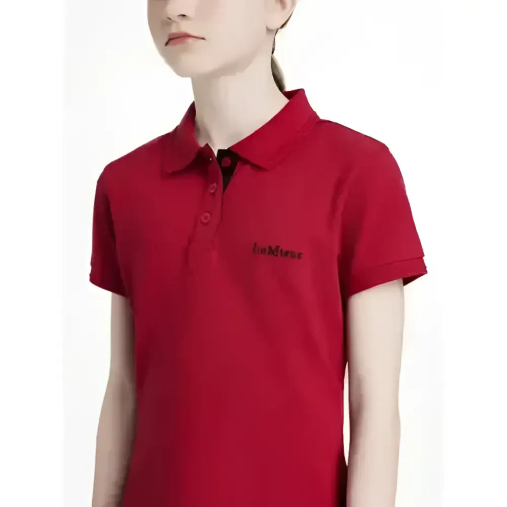 Red short-sleeved lemieux young rider classique polo shirt in chilli with black buttons and subtle chest logo