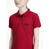 Red short-sleeved lemieux young rider classique polo shirt in chilli with black buttons and subtle chest logo