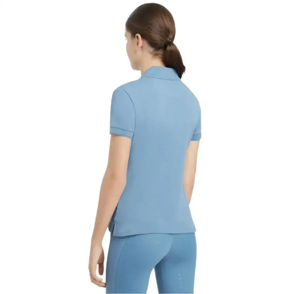 Light blue short sleeved polo shirt with classic collar and tailored fit lemieux young rider classique style
