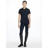 Black short-sleeved lemieux young rider classic polo shirt with subtle embroidered logo on left chest