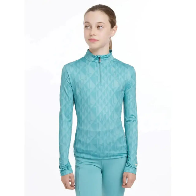Teal lemieux young rider clea base layer with subtle geometric pattern and half zip collar perfect for riding