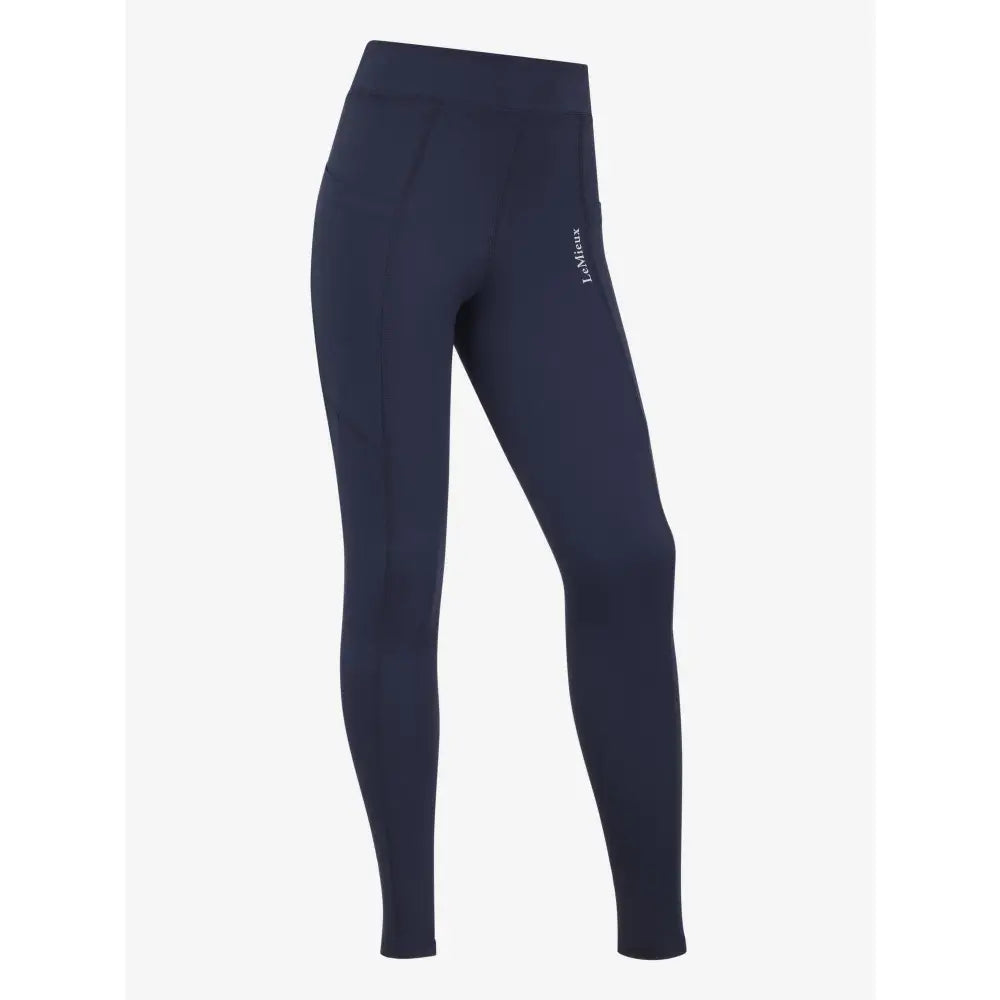 Navy blue high-waisted lemieux young rider darla sport legging with subtle white logo on the thigh in sport legging navy style