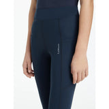 Navy high-waisted sport legging navy with subtle side seam and lemieux young rider logo on thigh darla sport legging