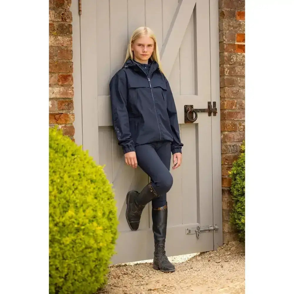 Navy dolcie waterproof jacket by lemieux young rider with hood and front zipper for young riders wet weather use