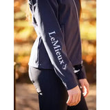 Dark navy blue lemieux young rider elite soft shell jacket sleeve with white embroidered branding on soft material