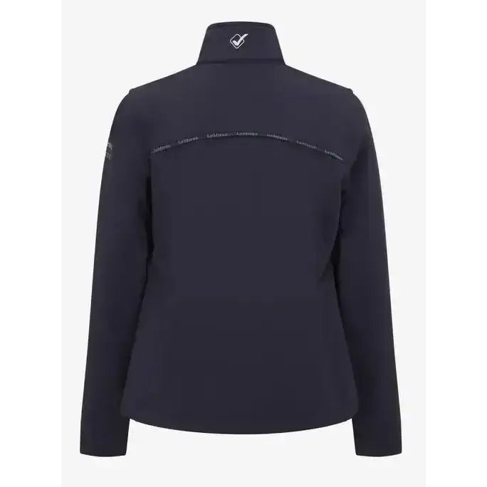 Dark navy blue lemieux young rider elite soft shell jacket with high neck white branding on shoulders and logo at collar