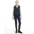 Person in Lemieux Young Rider Eloise Reversible Winter Gilet Navy with tall boots